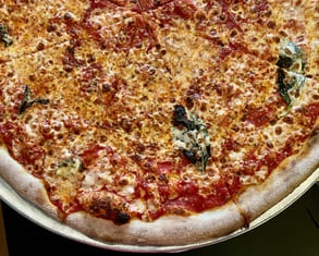 cheese pizza from best pizza in williamsburg brooklyn