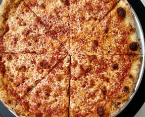 Classic cheese pizza at Mano's in Queens